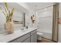 Bright bathroom featuring a modern vanity, bathtub, and decorative wall art at 2493 Cotton Ln, Douglasville, GA 30135