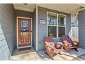 Cozy front porch with seating offers a relaxing outdoor space to enjoy a morning coffee or an evening sunset at 305 Norwood Ne Ave, Atlanta, GA 30317