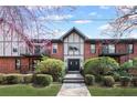 Charming condo building with red brick facade, stylish trim, balconies, and well-manicured landscaping at 6851 Roswell Rd # F36, Atlanta, GA 30328