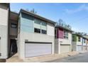 Modern townhouse with a concrete and siding exterior and attached garage at 1342 Rietveld Nw Row, Atlanta, GA 30318