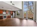 Open-concept living space with modern kitchen, stainless steel appliances, and expansive windows at 1342 Rietveld Nw Row, Atlanta, GA 30318