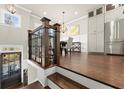 Open-concept dining area with hardwood floors, chandelier lighting, and stainless steel appliances at 226 Chastain Preserve Ne Ln, Atlanta, GA 30342