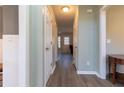 Inviting foyer with neutral paint, wood-look floors, and decorative molding for a classic touch at 25 Shadowbrook Ct, Covington, GA 30014