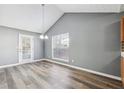 Dining area with a view to the outside and a modern chandelier at 6187 Harvard Ct, Morrow, GA 30260