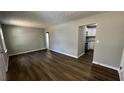 Spacious living room featuring wood floors and neutral tones, creating a calming environment at 110 Raymond St, Jonesboro, GA 30236