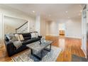 Spacious living room features hardwood floors, recessed lighting, and staircase to second level at 111 Paces Run, Atlanta, GA 30339