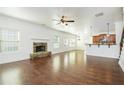 Bright living room with hardwood floors, stone fireplace, and open floor plan at 3129 Arbor Oaks Dr, Snellville, GA 30039