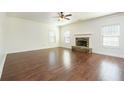 Spacious living room featuring a fireplace, hardwood floors, and neutral wall color at 3129 Arbor Oaks Dr, Snellville, GA 30039