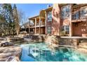 Stunning backyard features a free form pool, spa, and lounging areas at 2250 Blackheath Trce, Alpharetta, GA 30005