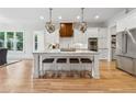 Modern kitchen featuring a large island with seating, stainless steel appliances, and bright white cabinetry at 4333 Rickenbacker Ne Way, Atlanta, GA 30342