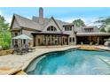 Lovely backyard pool with ample patio space for relaxing and entertaining at 829 Big Horn Holw, Suwanee, GA 30024