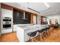 Contemporary kitchen with a large island, modern appliances, and stylish pendant lighting at 2009 Kensington Green Se Dr, Smyrna, GA 30080