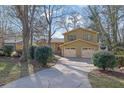 This property features a two-car garage and a long driveway for easy parking at 4570 Nantucket Sw Dr, Lilburn, GA 30047