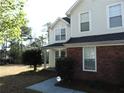 Charming two-story home featuring a combination of red brick and light siding at 1662 Maple Trace Ct, Grayson, GA 30017