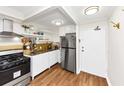 Bright kitchen featuring stainless steel appliances and updated white cabinetry at 2285 Peachtree Rd Ne # 803, Atlanta, GA 30309