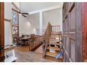 Bright, spacious foyer has an open floor plan, hardwood floors, and stairway with wood banister at 2664 Stonebrook Ne Ct, Roswell, GA 30075