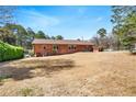 Spacious backyard with a well-maintained lawn and privacy fencing, perfect for outdoor activities at 2297 Hylaea Rd, Tucker, GA 30084