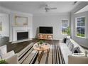 Bright living room features modern furnishings, a fireplace, and large windows offering an inviting space at 45 Hampton Dr, Cartersville, GA 30121