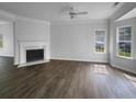 Bright and airy living room features a fireplace, gleaming hardwood floors, and natural light at 45 Hampton Dr, Cartersville, GA 30121