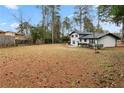 Expansive grassy backyard with mature trees offering shade and privacy, perfect for outdoor activities at 2158 Oregon Ct, Decatur, GA 30032