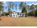 Spacious backyard features lush greenery, with a patio and manicured landscaping near the home at 2158 Oregon Ct, Decatur, GA 30032