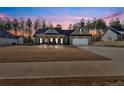 Beautiful single-story home with large front yard, a two-car garage, and classic architectural details at 598 Barnwood Dr, Rockmart, GA 30153