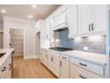 Modern kitchen showcases white cabinets, subway tile backsplash, and stainless steel appliances at 108 Redford Ln, Canton, GA 30115
