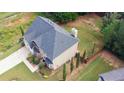 An aerial view of the home showcasing the spacious backyard and a well-maintained roof at 85 Providence Pkwy, Covington, GA 30014