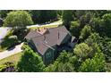 Secluded home featuring rear screened in porch, surrounded by lush trees and landscaping at 11 York Trce, Cartersville, GA 30121