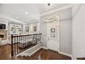 Welcoming foyer with hardwood floors, chandelier and staircase leading into the living room at 2362 Saint Davids Nw Sq # 4, Kennesaw, GA 30152