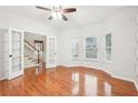 Bright home office with hardwood floors, french doors, ceiling fan, and plenty of natural light at 2118 Township Dr, Woodstock, GA 30189