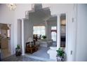 Elegant foyer with decorative columns leading to the living room and a glimpse of the kitchen at 4288 Wyndham Park Cir, Decatur, GA 30034