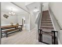 Bright dining area featuring modern decor, light floors and a staircase with a safety gate at 515 Quinn Dr, Woodstock, GA 30188