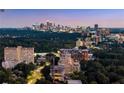 An evening skyline as viewed from the real estate provides an idea of what the area has to offer at 2660 Peachtree Nw Rd # 11G, Atlanta, GA 30305