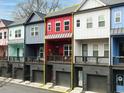 Charming townhome exteriors with colorful facades, garages, and front balconies highlighted at 166 Color Cir, Atlanta, GA 30317