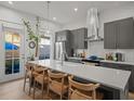 Modern kitchen featuring a large island, stainless steel appliances, and pendant lighting at 166 Color Cir, Atlanta, GA 30317