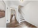 Bright entryway featuring hardwood floors and a staircase with white railings at 185 Willow Stream Ct, Roswell, GA 30076