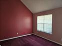Cozy bedroom featuring a window for natural light and plush carpeting for added comfort at 4183 Ward Lake Trl, Ellenwood, GA 30294