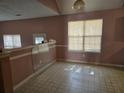 Bright dining area featuring large windows, tile flooring, and ample space at 4183 Ward Lake Trl, Ellenwood, GA 30294