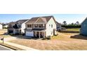 This lovely two-story home boasts a well-manicured lawn and a convenient two-car attached garage at 117 Cottage Nw Walk, Cartersville, GA 30121