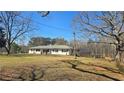 Charming ranch style home with level lawn and mature trees, offering a peaceful setting at 187 Bowden Rd, Ellenwood, GA 30294
