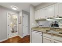 Convenient kitchen space with granite counters adjacent to bath and living area at 300 Johnson Ferry Ne Rd # A313, Atlanta, GA 30328