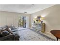 Cozy living area featuring balcony access, comfortable seating, and natural light at 300 Johnson Ferry Ne Rd # A313, Atlanta, GA 30328