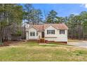 Lovely home with well-manicured lawn, surrounded by mature trees at 370 Burton Dr, Douglasville, GA 30134