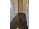 Hallway featuring two styles of flooring and access to a storage area at 959 Romer Pl, Stone Mountain, GA 30083
