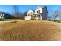 Landscaped lawn of this home shows a classic architectural design with inviting front porch at 20 Running Nw Ter, Cartersville, GA 30121