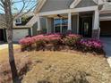 Inviting front yard with blooming azaleas adding vibrant color to the landscape at 410 Windy Ridge Way, Canton, GA 30114