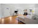 Inviting living room with a cozy fireplace, hardwood floors, and white walls, perfect for relaxation at 1201 Thomas Rd, Decatur, GA 30030
