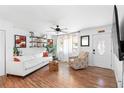 Bright living room featuring hardwood floors, white walls, and lots of natural light at 368 Triumph Se Cir, Atlanta, GA 30354
