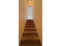 A carpeted staircase leading to the next level of the home at 7123 Williamsburg Dr, Riverdale, GA 30274